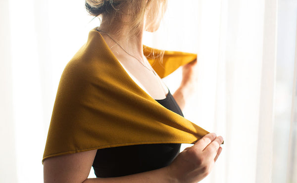 A person using the Shepherd's Wool Utility Cloth as a shawl.